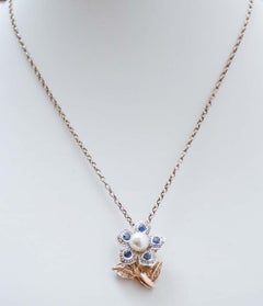Perle, saphirs, diamants, pendentif fleur en or rose 14 carats et argent.