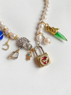 Pearl, skull and golden lock multi charm necklace