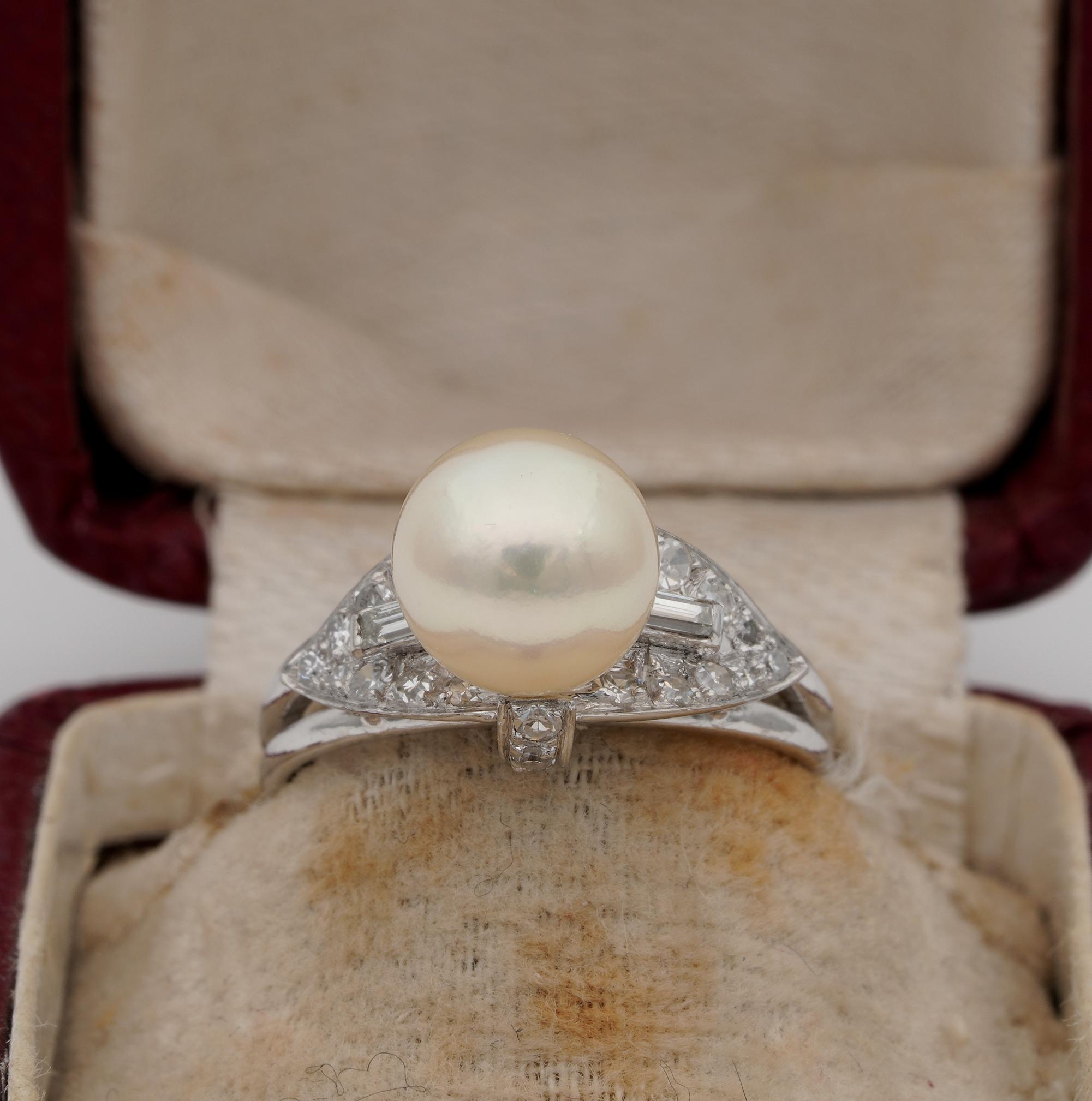 Her Majestic the Pearl
Elegantly designed and crafted is this beautiful mid century Pearl Solitaire ring complemented by Diamonds
post 1960 ca, hand crafted of solid Platinum marked
Articulate in design showing geometric shoulders and sinuous up