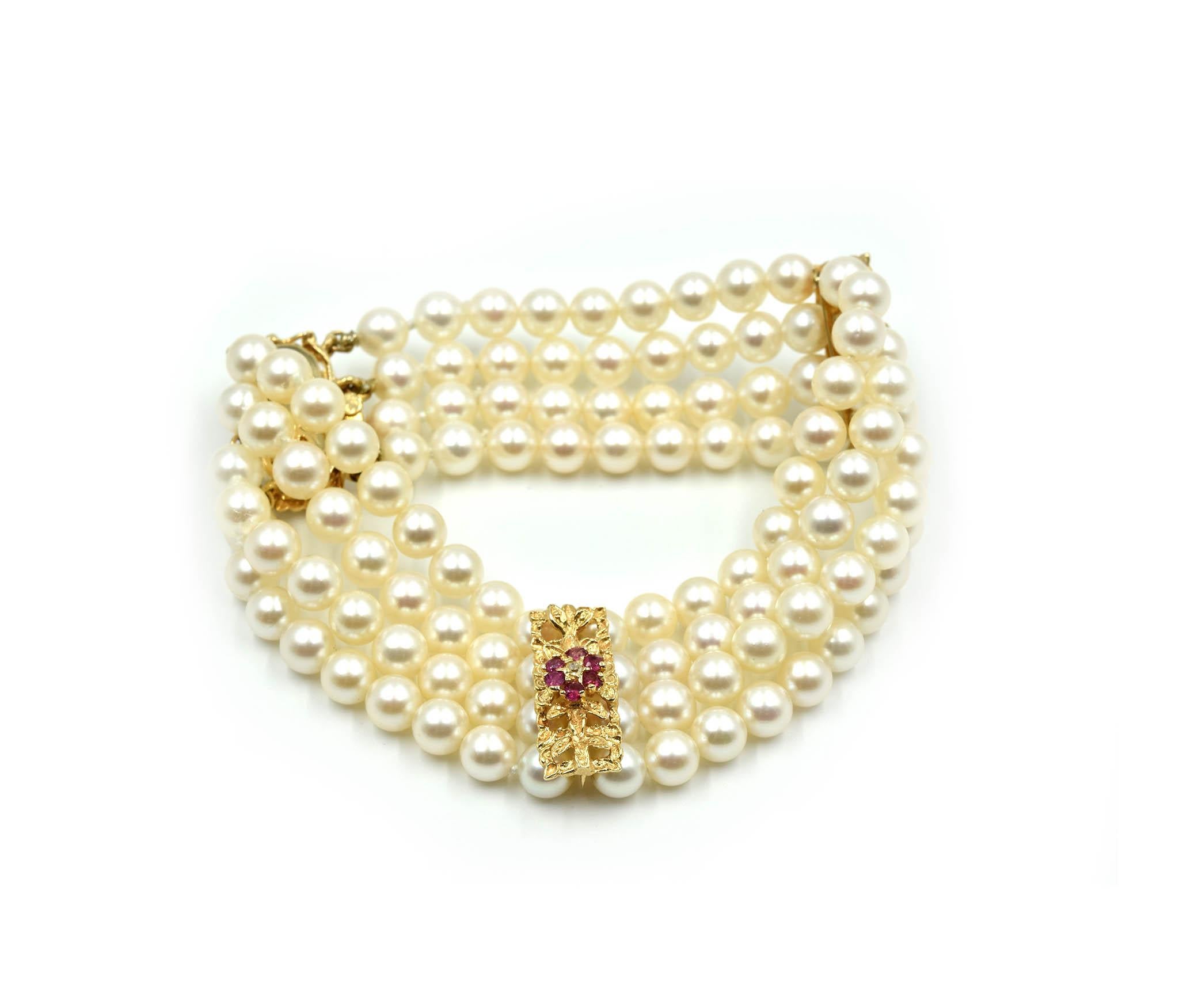 Round Cut Pearl Strand Bracelet with 14 Karat Yellow Gold Ruby Stations