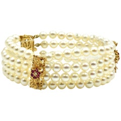 Pearl Strand Bracelet with 14 Karat Yellow Gold Ruby Stations