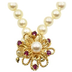 Pearl Strand Necklace with 14 Karat Yellow Gold Ruby Flower Centerpiece