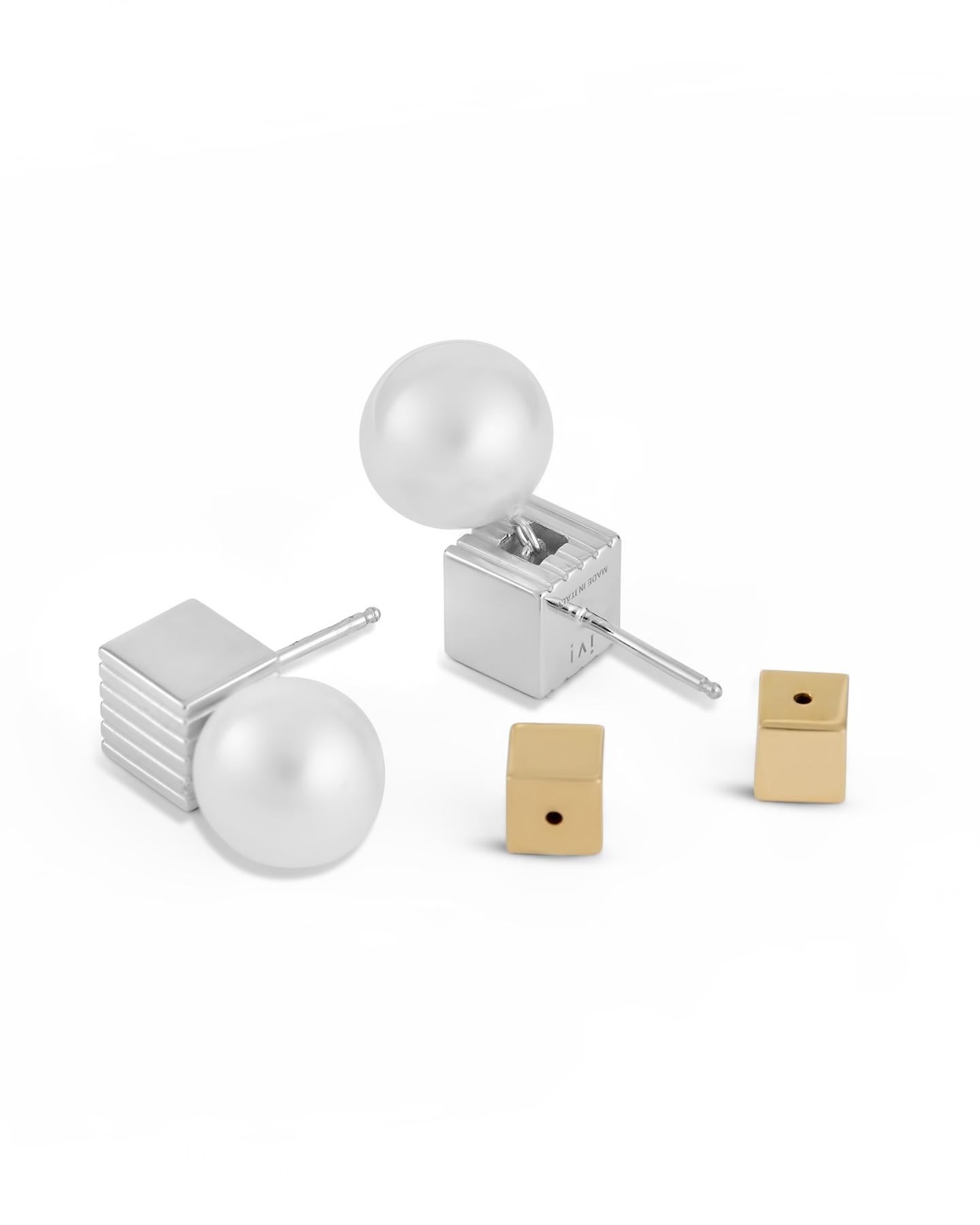 The rhodium-plated Pearl Stud drops combine a signature IVI shape with vintage-inspired accents. They’re crafted with a hollow cube stud that’s meticulously engraved and feature a shimmering pearl drop.

Details:
925 Sterling Silver
Plated in