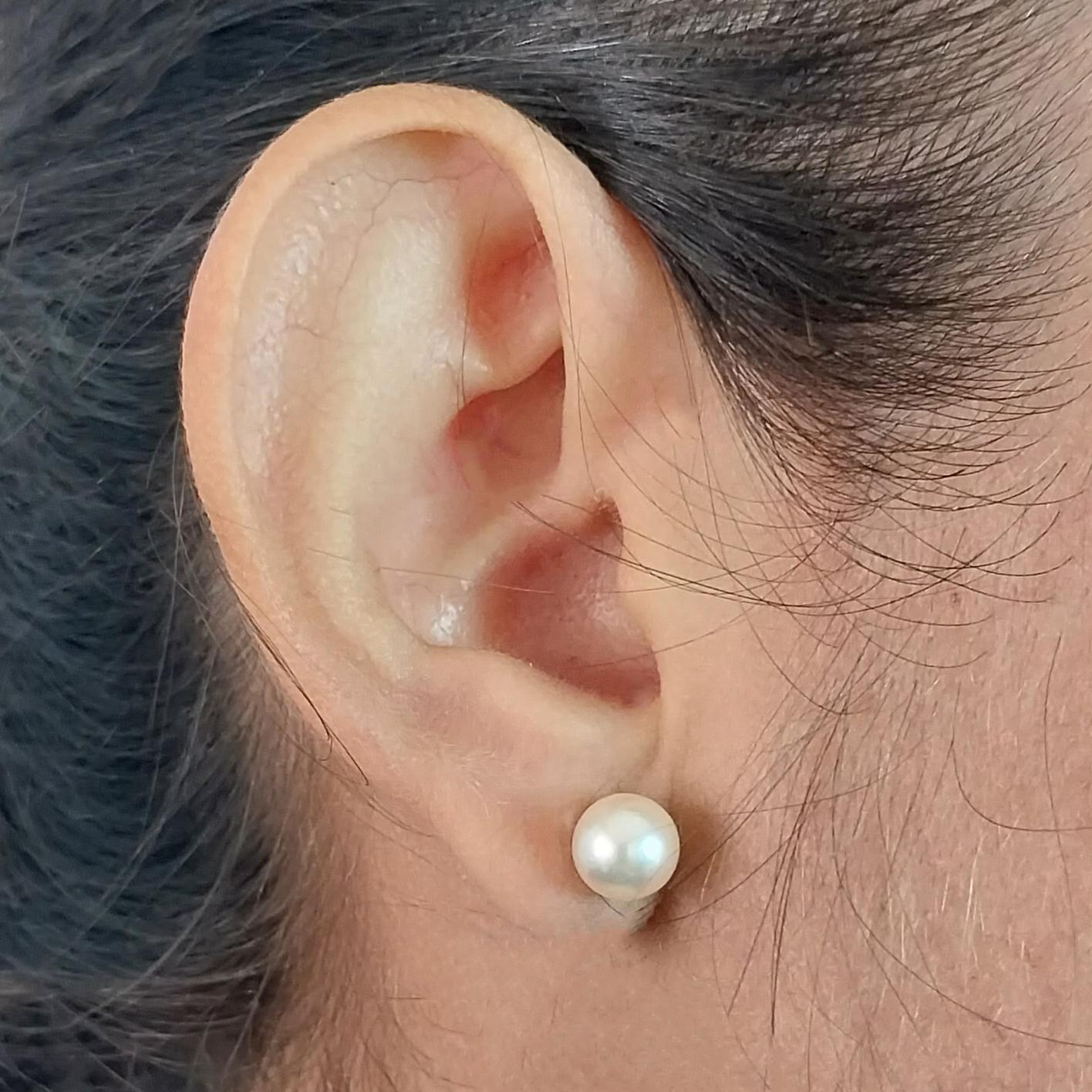 18 Karat Yellow Gold Stud Earrings Featuring Two 7.5mm Cultured Pearls. Pierced Post with Friction Back.