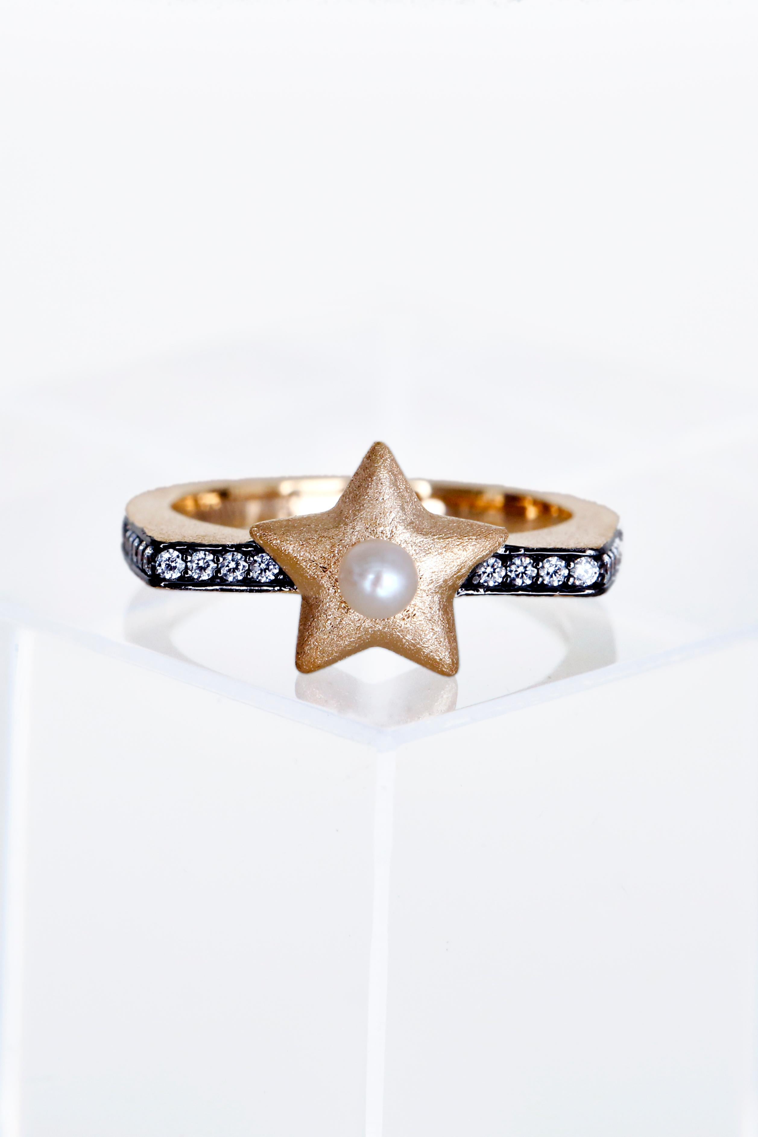 Our newest addition to our Sa'mma = sky collection is the pearl star ring. Inspired by the sky; the universal blanket that covers mankind and protects us under its wings. Hand crafted; vermeil gold with fresh water pearl and clear cubic zircon. 