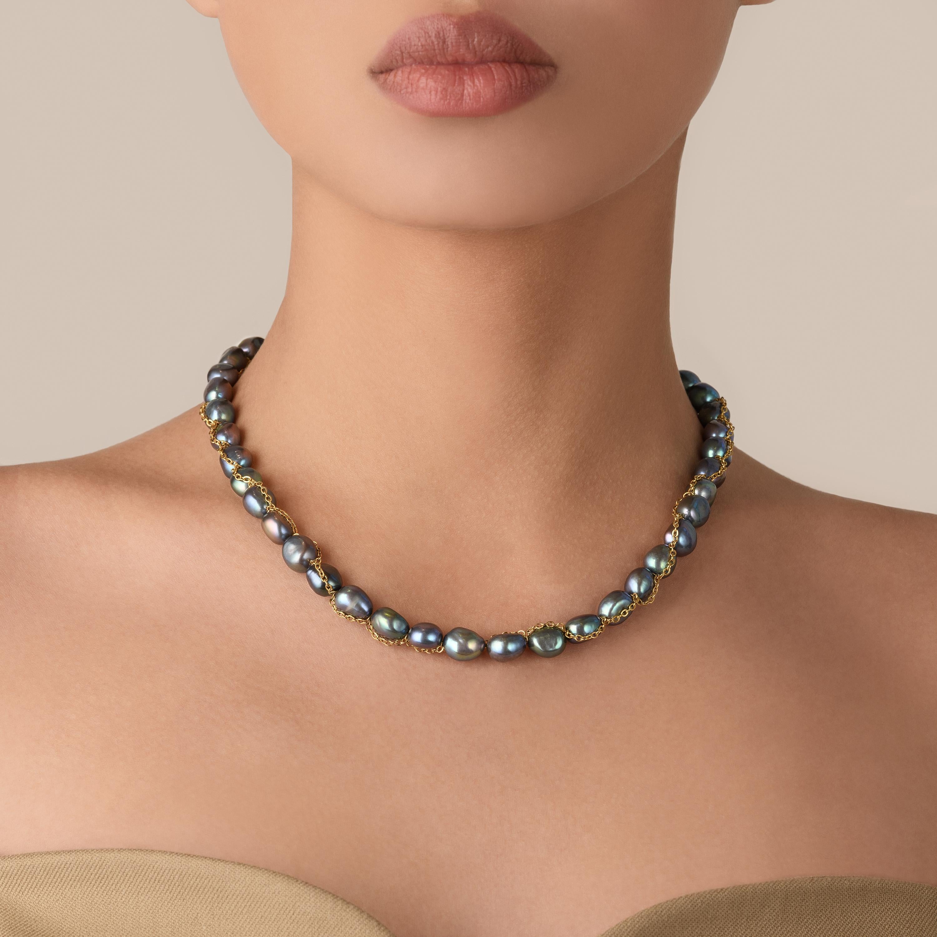 Indulge in the lavishness of our meticulously crafted Baroque Pearl Necklace in Blue, a true embodiment of refined sophistication. This exquisite piece combines the allure of 8-9mm baroque pearls with the opulence of an 18K gold plated stainless