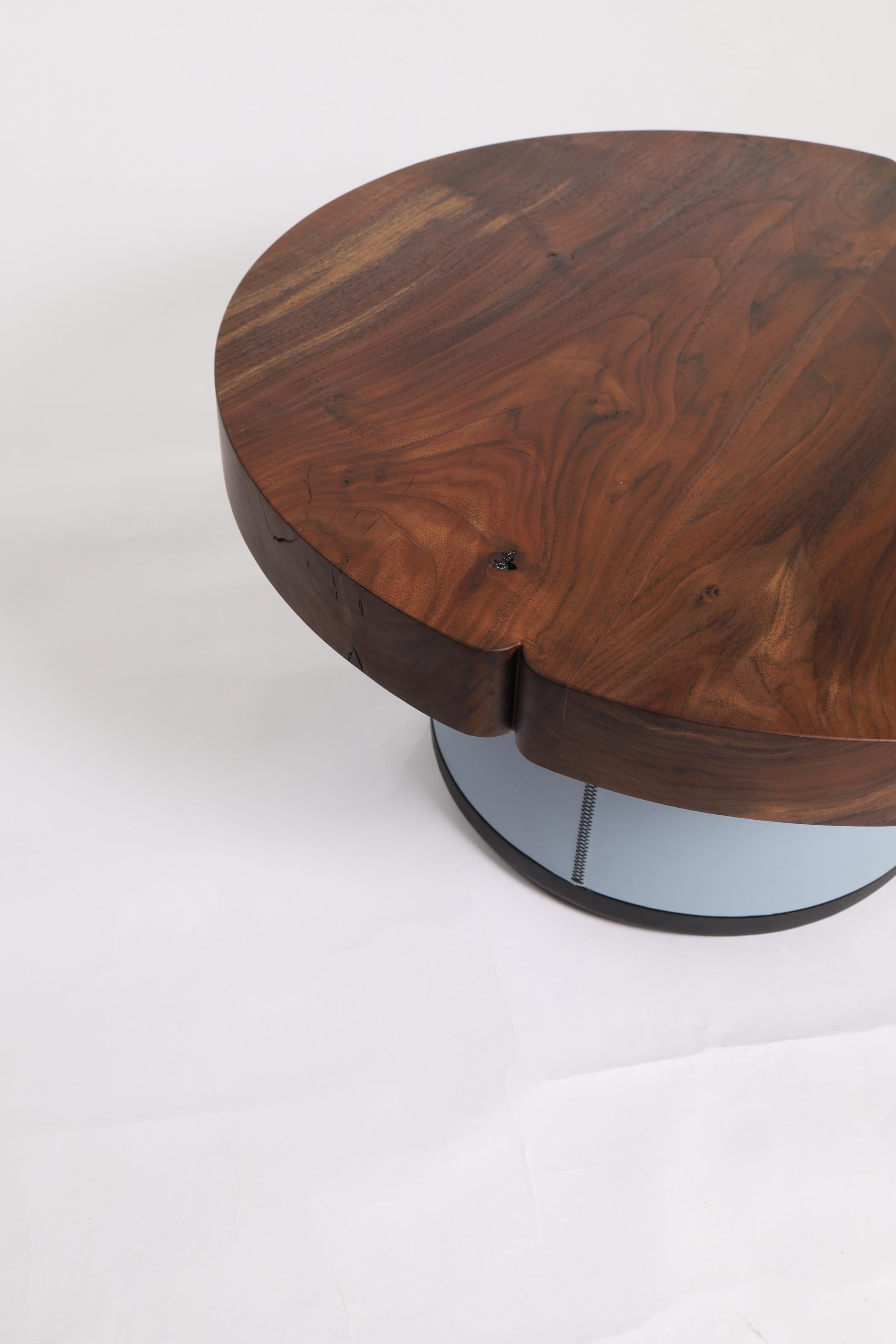 In the diameter of your choosing, each top receives two sculpted inverted pinch points that are blended into each round creating a minimal but distinctive design detail. The base of the table is a high quality bridle leather that is corset wrapped