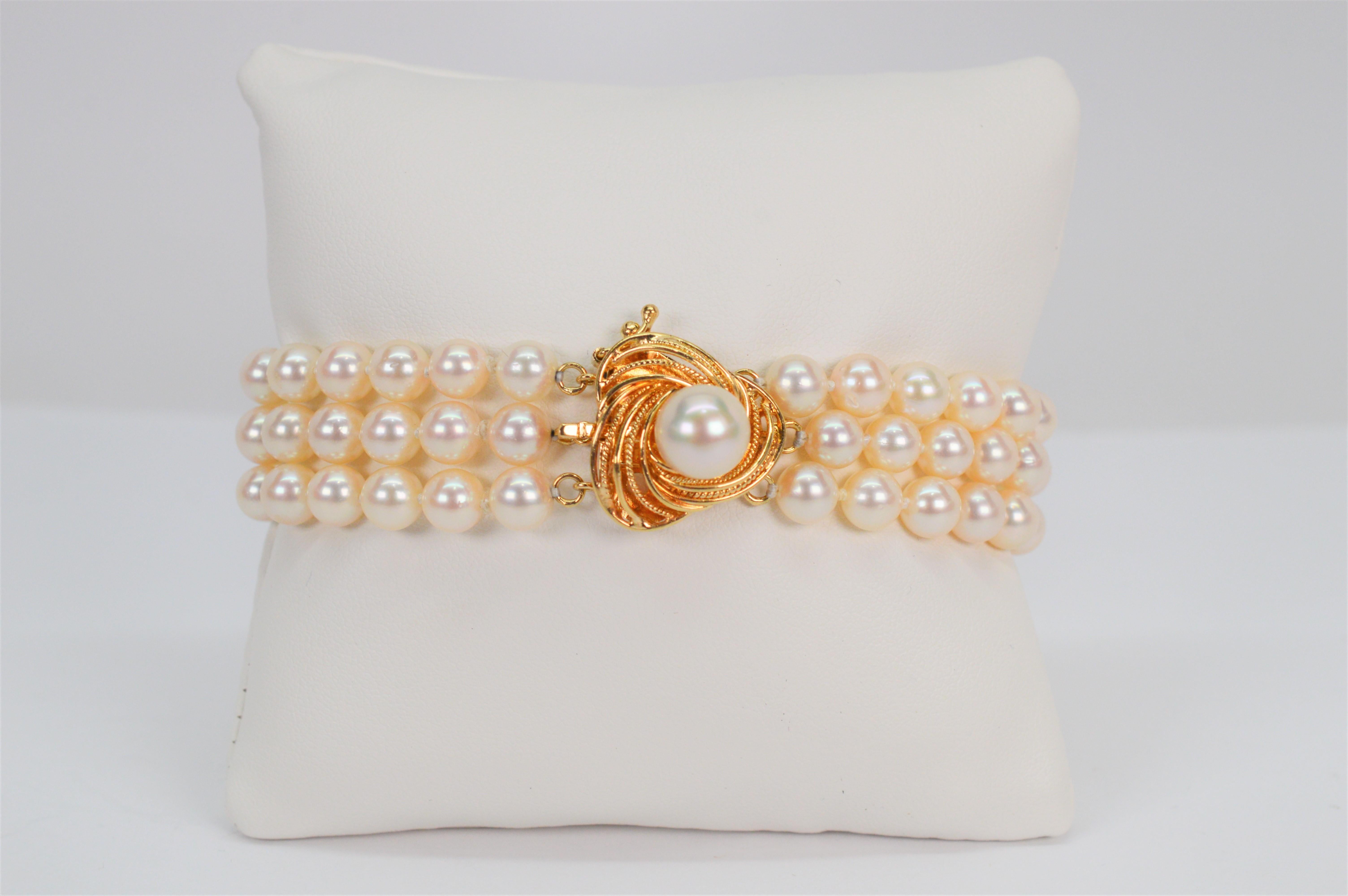 With stylish flair, this elegant beaded bracelet features a contemporary decorative clasp with one lustrous 8.5mm round AAA Akoya Pearl nested in swirls of 14 karat yellow gold. The clasp is an elegant focal point, measuring 5/8 which also functions