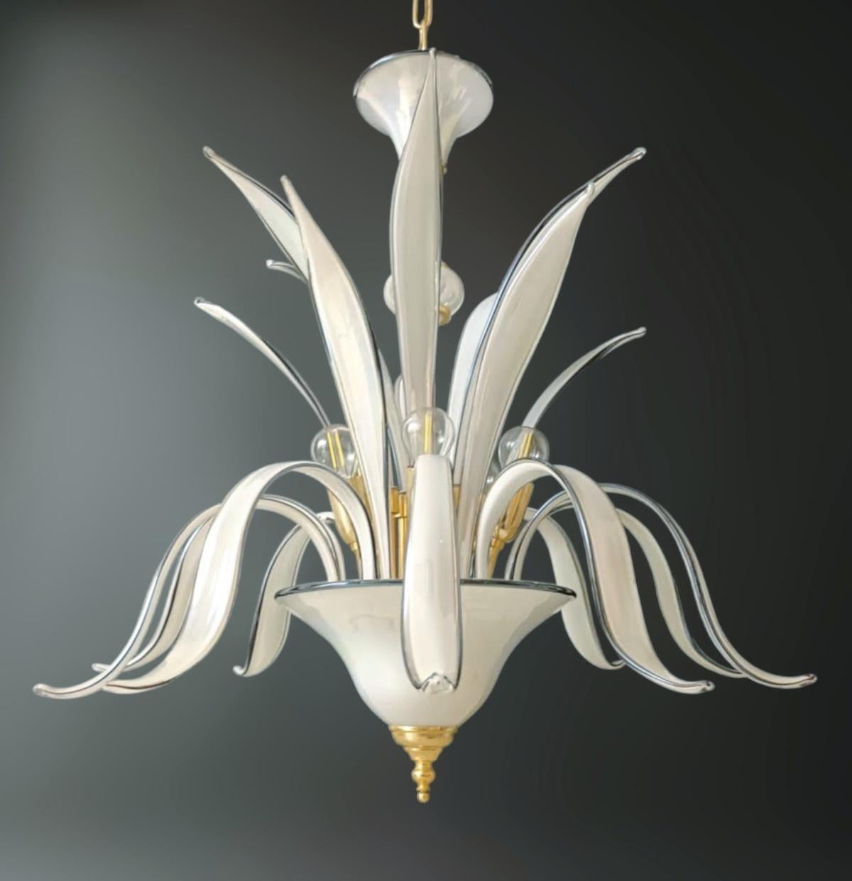 Vintage Italian Venetian chandelier with elegant pearl colored Murano glass leaves with black edge / Made in Italy, circa 1970s
Measures: Diameter 25.5 inches, height 27.5 inches, total height 45 inches including original chain and canopy
5 lights /