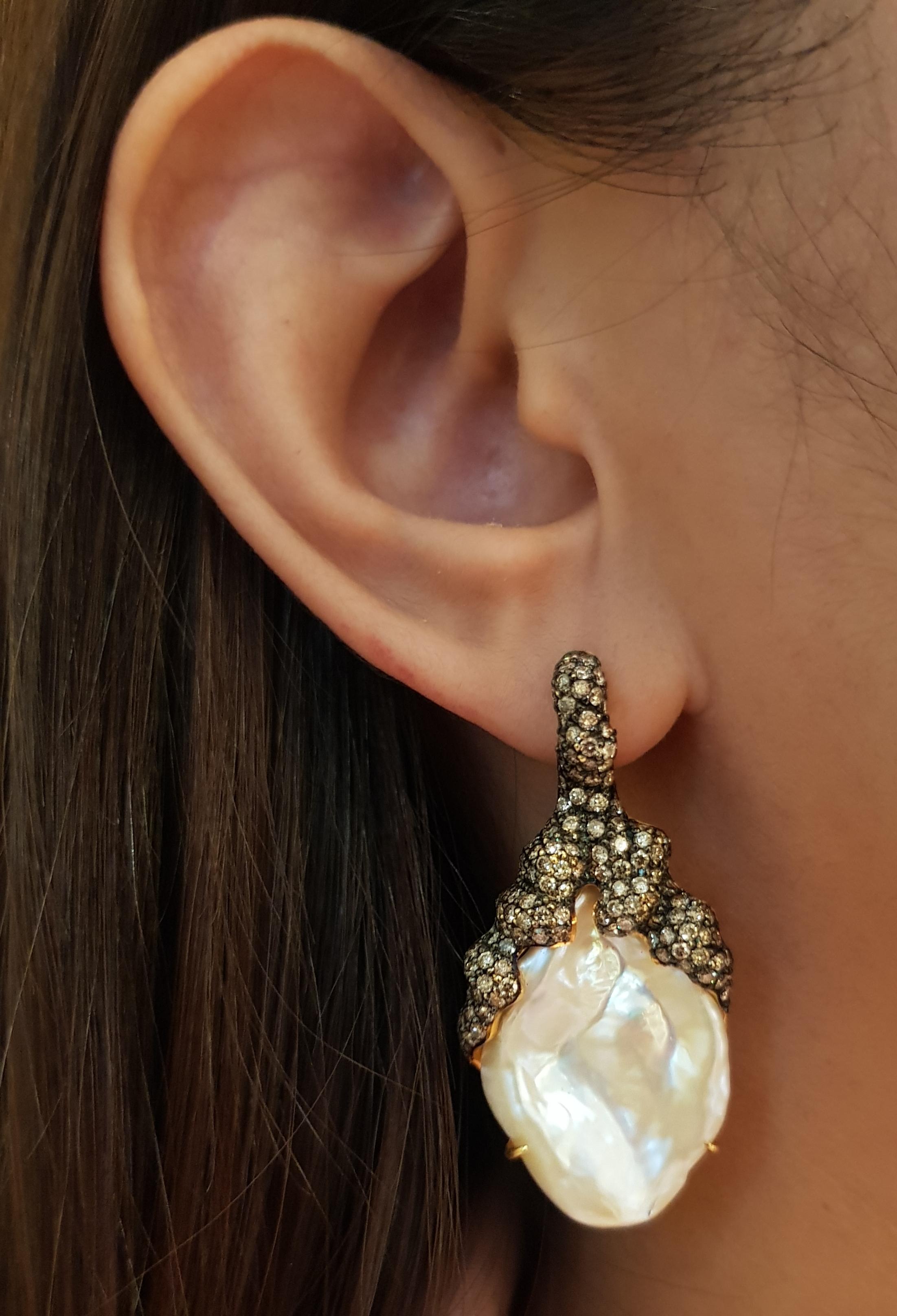 Pearl with Brown Diamond 3.02 carats Earrings set in 18 Karat Gold Settings

Width:  2.1 cm 
Length:  4.3  cm
Total Weight: 22.97 grams

