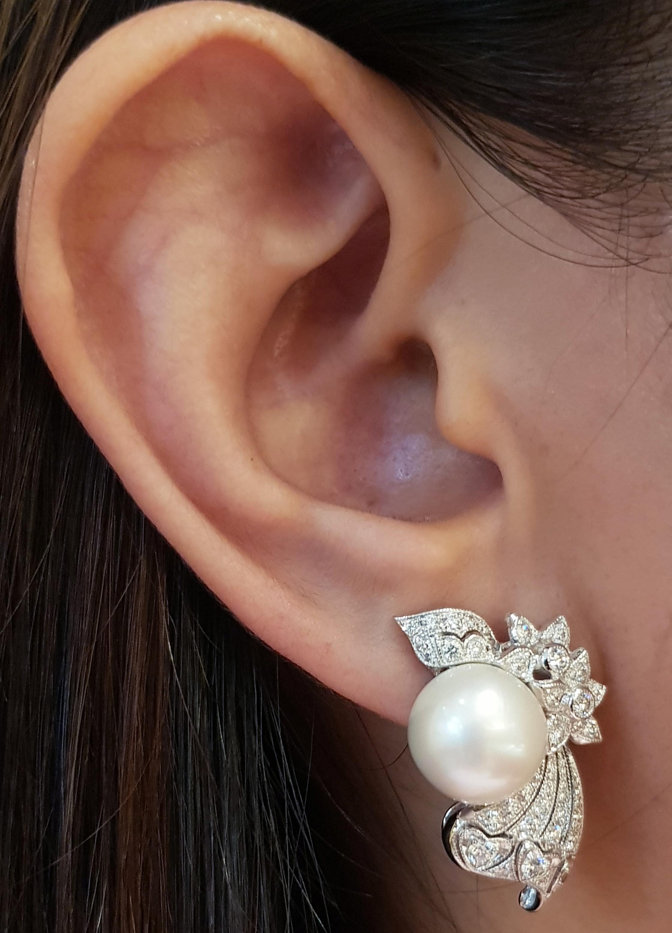 Pearl with Diamond 1.18 carats Earrings set in 18 Karat White Gold Settings

Width:   1.90 cm 
Length:  2.90 cm
Total Weight: 15.12 grams

Pearl: 10.8 mm

