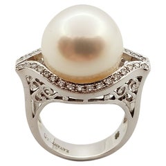 Bague en or blanc 18 carats sertie d'une perle et d'un diamant