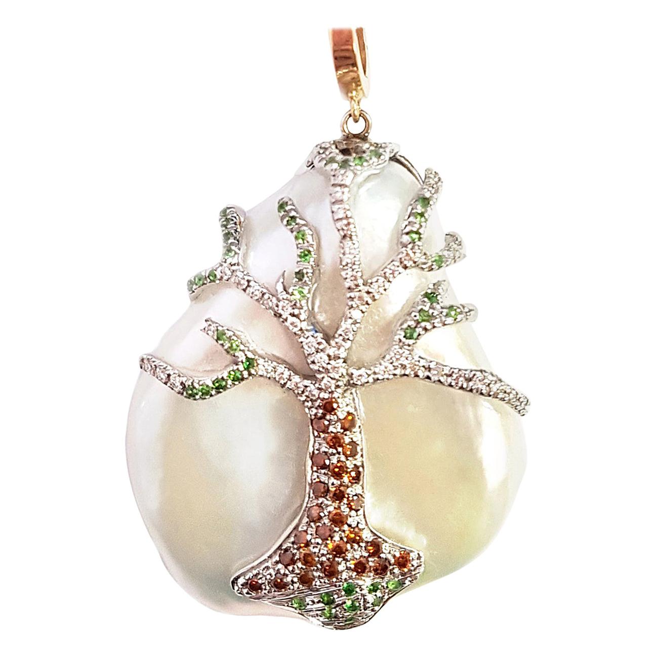 Behold the grandeur of this massive pearl pendant and white gold chain -- a true marvel of artistry and creativity. Crafted with exquisite skill, this pendant is a masterpiece that exudes opulence and elegance.

A large pearl serves as the canvas