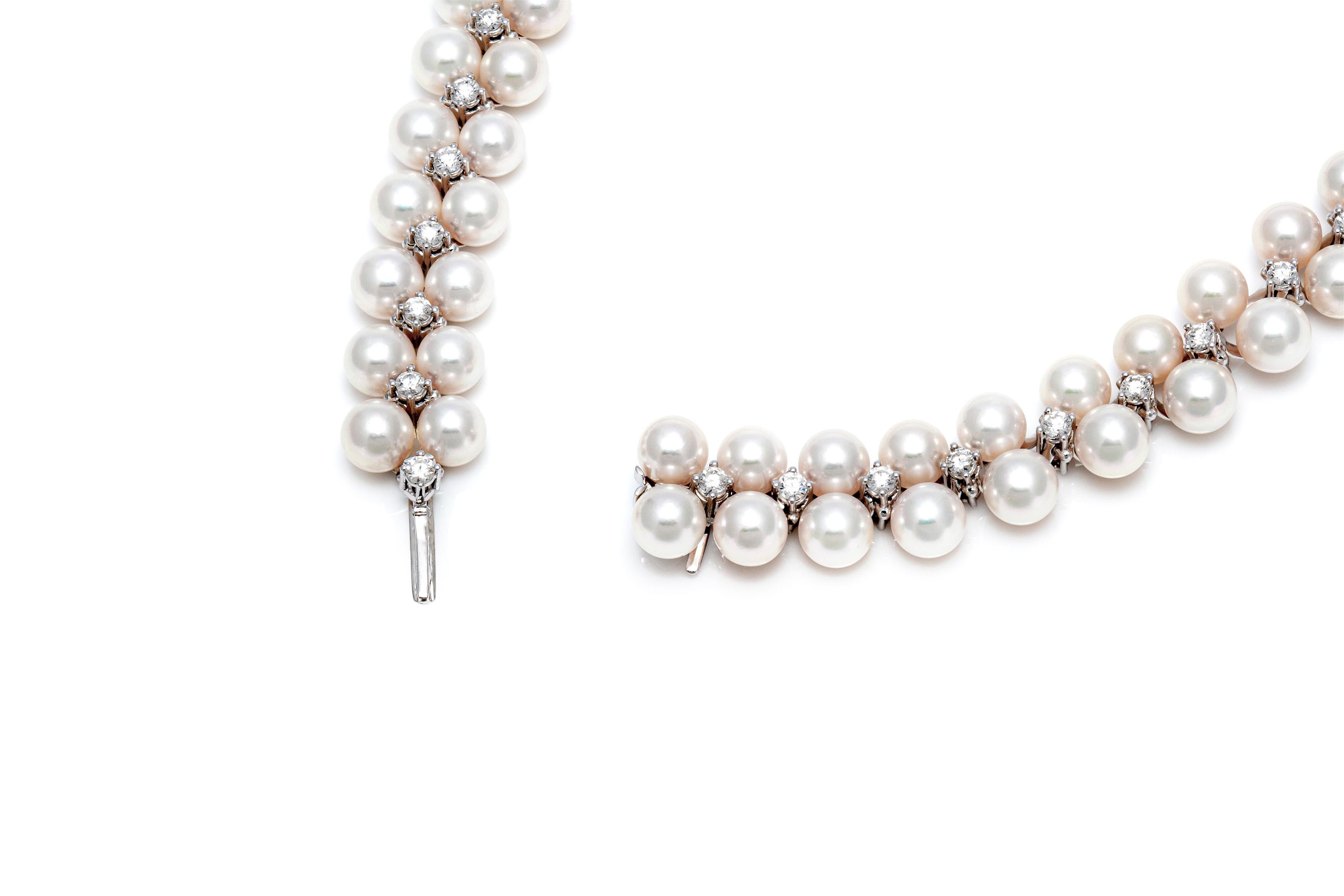 The necklace is finely crafted in 18k white gold with pearls all over and diamonds between that weighing approximately total of 4.50 carat and the size of the pearls is 8.00-9.00 mm.
