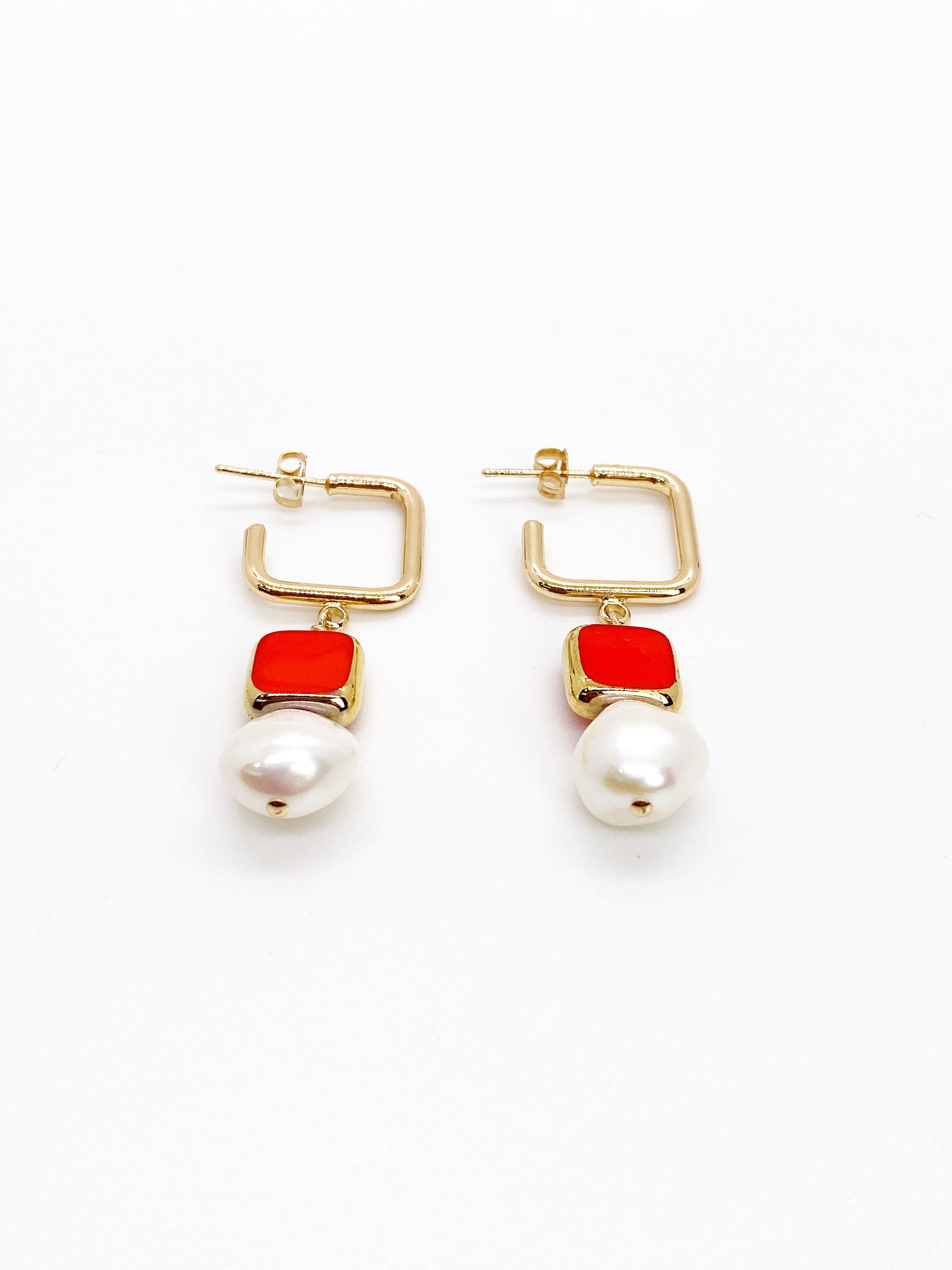 Simple and elegant. The earrings consist of opaque red colored glass beads with freshwater pearls which hang on 18K gold fill earring component.

The vintage German glass beads are edged with 24K gold and were hand pressed during the 1920s- 1960s.