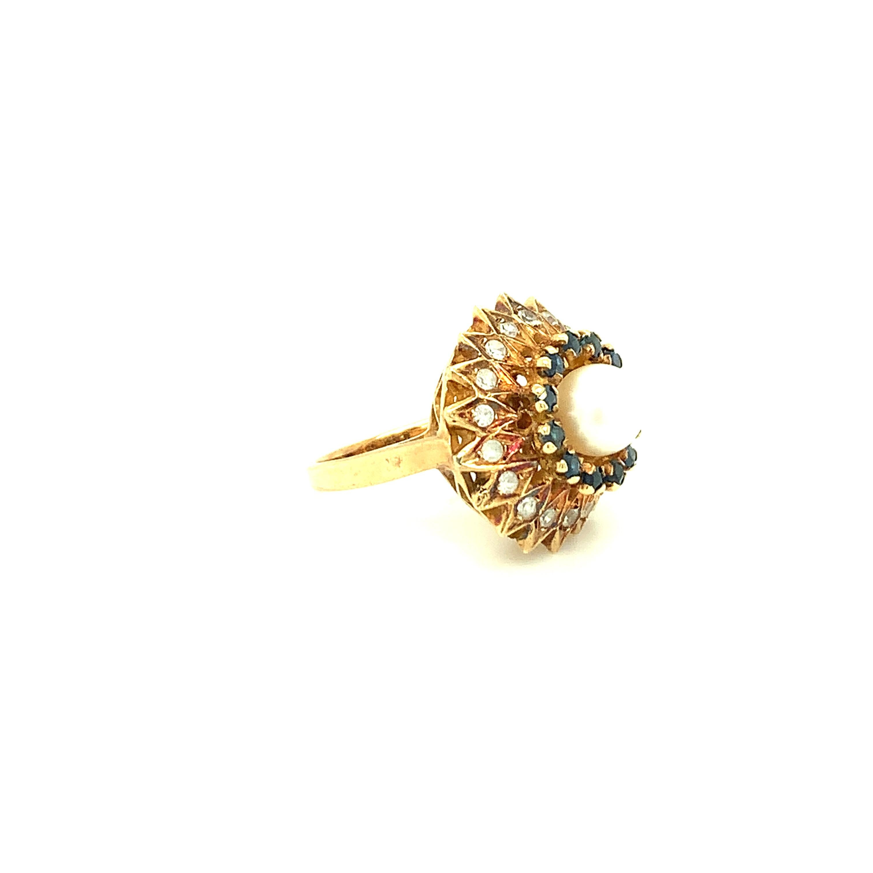 A keepsake to cherish, this pearl ring is a unique find. Cultured pearl artfully sits in the middle surrounded by blue sapphire and diamond on outer circle is crafted in 14K yellow gold.