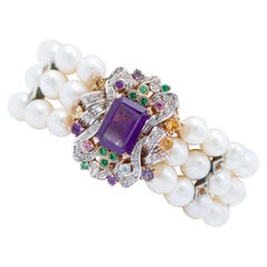 Pulsera de perlas, amatistas, diamantes, topacios, turmalina y piedras verdes.