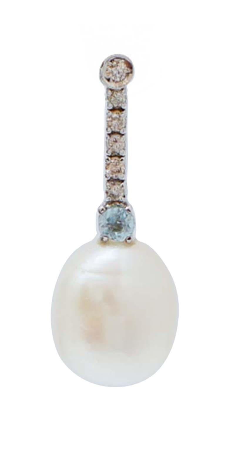 Amazing earrings in 14 kt white gold  structure mounted with diamonds for all the length. Below, a topaz and, as pendant, a pearl.
Diamonds 0.26 ct
Topaz 0.34  ct
Pearls 4.70 gr - 11 mm
Total Weight 6.30 gr
RF +GGIA
RK.AGHC92

For any information,