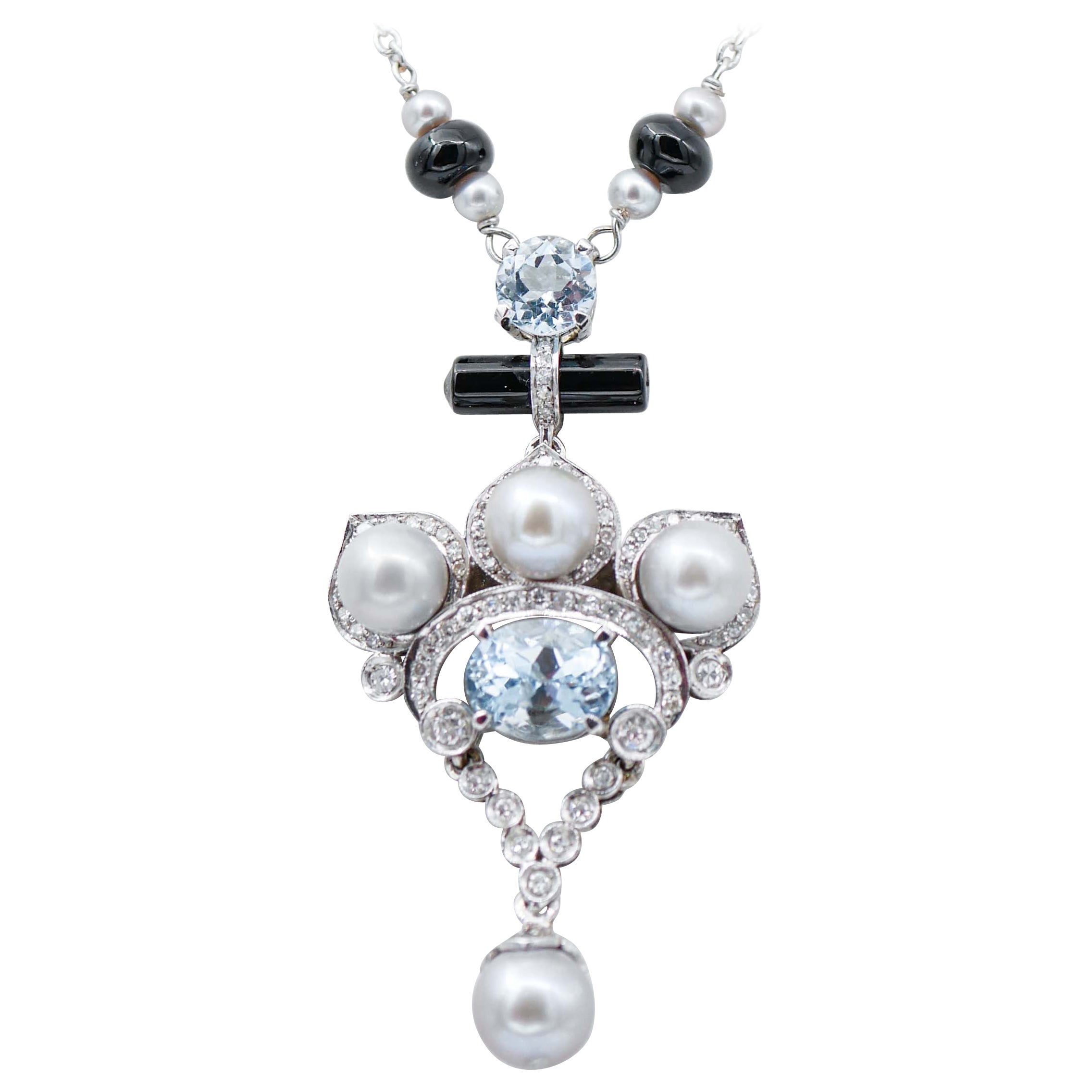 Collier pendentif perles, aigue-marine, diamants, onyx et platine en vente