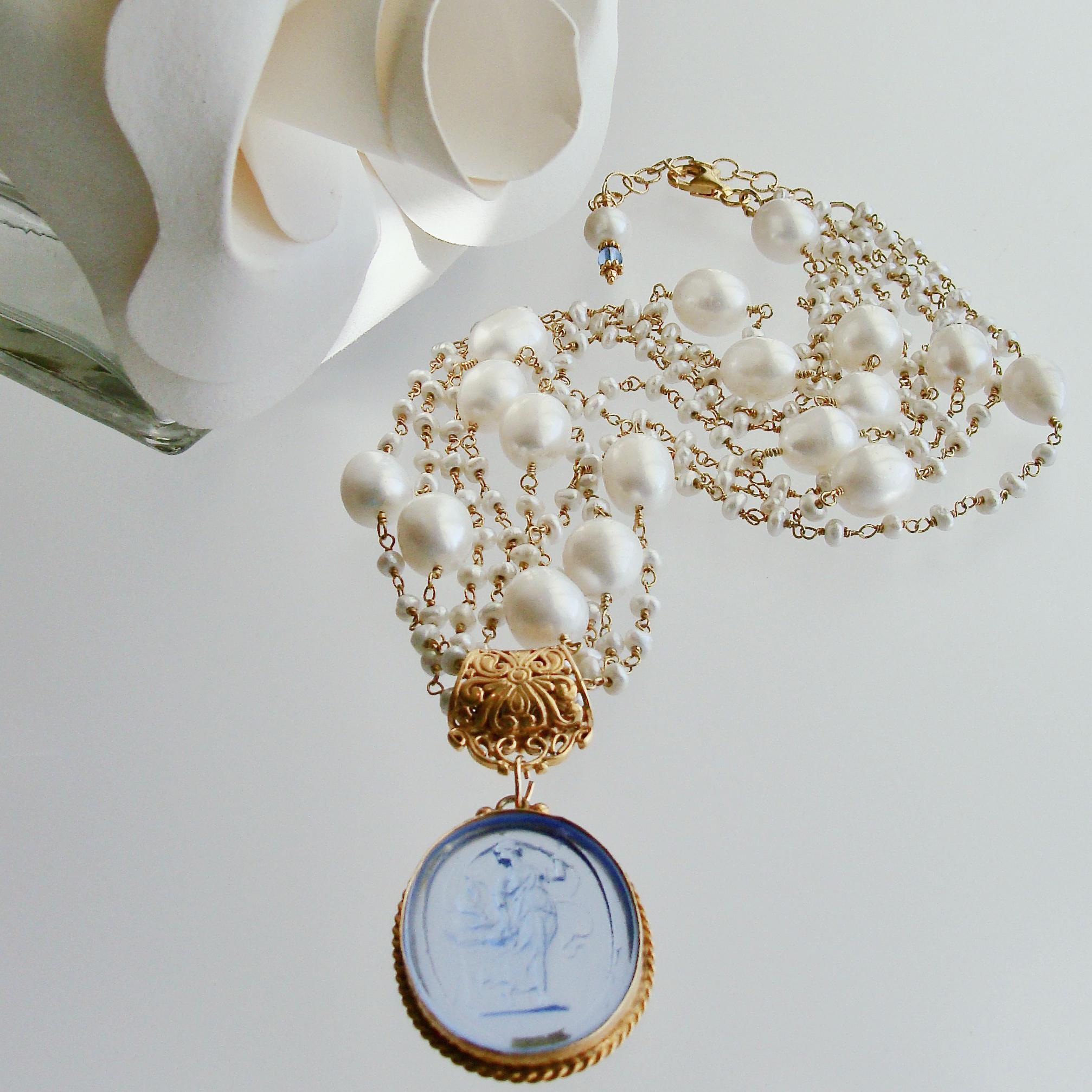 The elegant beauty of simple strands of hand-linked creamy satin seed pearls, intercepted by larger baroque pearls, is the perfect compliment to this neoclassical cornflower blue Venetian glass cameo/intaglio pendant.  The adjustable closure allows