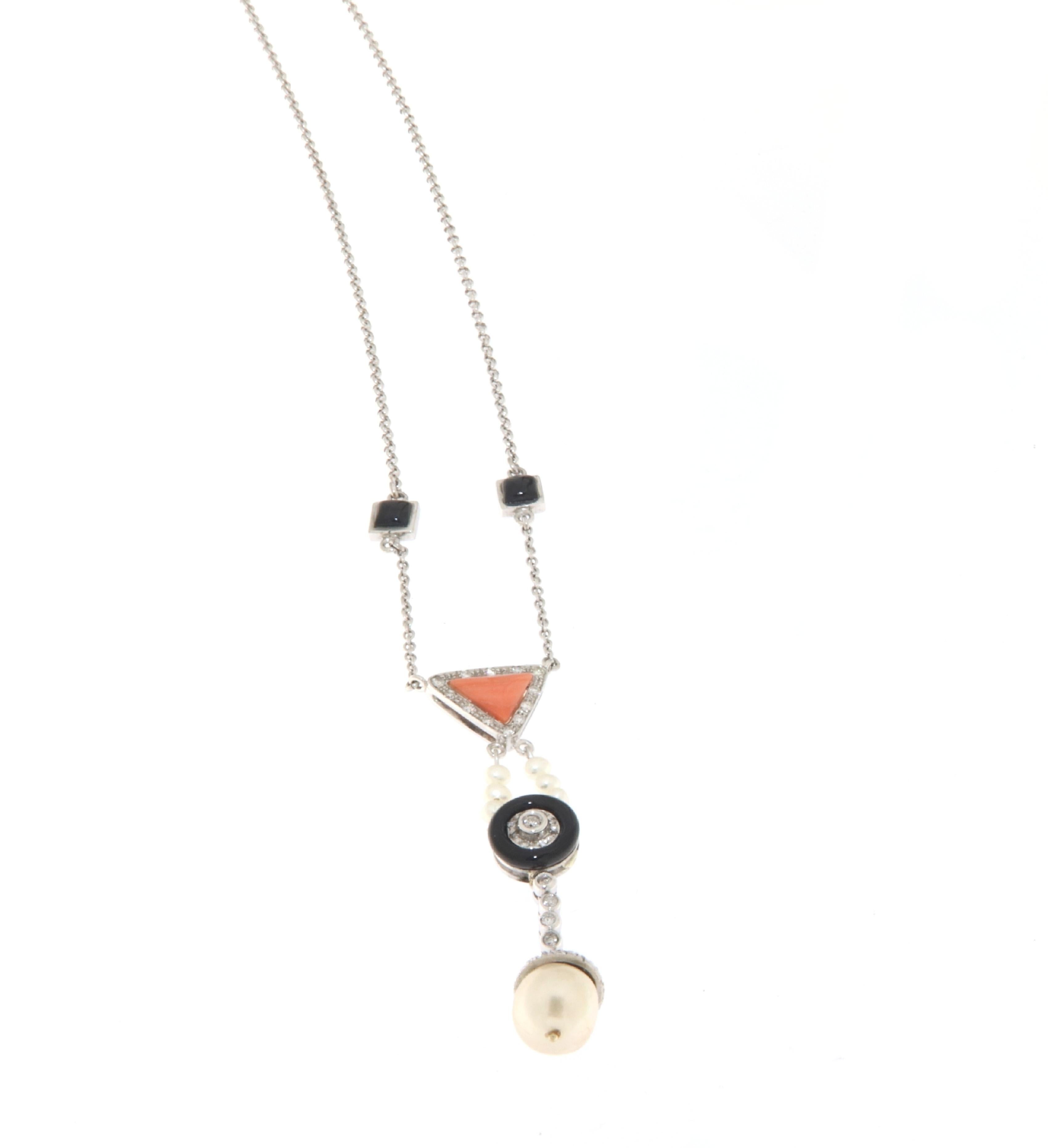 This exquisite necklace, artfully crafted in 18-karat white gold, presents a pendant that is a symphony of natural beauty and sophistication. Gracefully suspended, the pendant features an elegant array of pearls, a natural coral inlay, onyx accents,