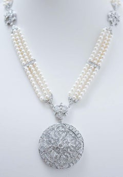 Collier à pendentifs en perles, diamants et or blanc 14 carats.
