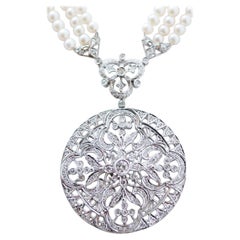 Collier à pendentifs en perles, diamants et or blanc 14 carats.