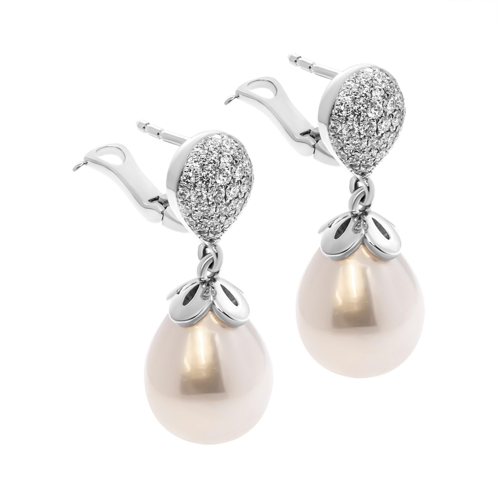Drop Earring in 14K White Gold 
 10mm Freshwater Pearl and diamonds totaling 0.58ct