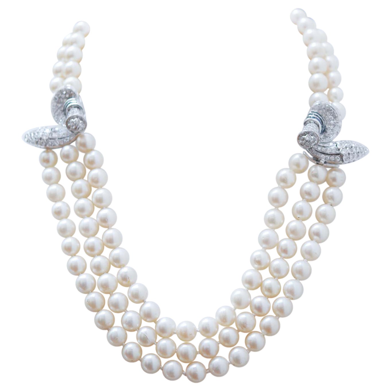 Collier de perles, diamants et saphirs en vente