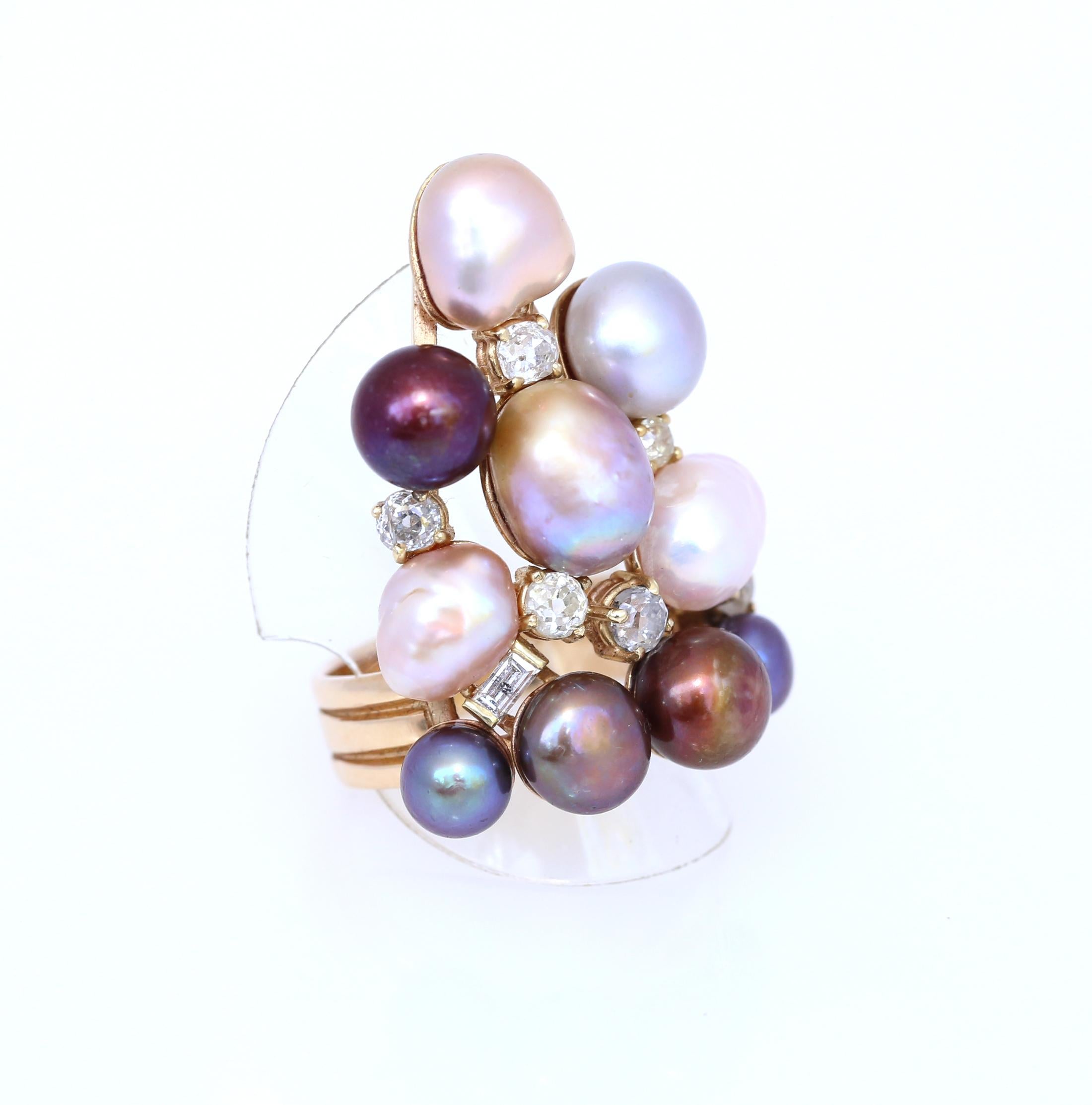 Variously shaped natural and cultured Pearls of different tints and color shades. Highlighted by the Round and Baguette-cut Diamonds. Created in 2007, a ring for any finger and also that can be worn facing up or down. Please take a look at all the