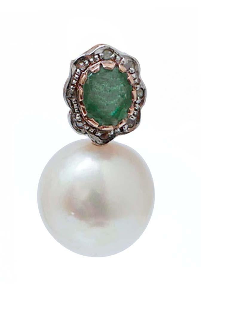Retrò earrings in 9 kt rose gold and silver structure mounted with an emerald surrounded by a frame of diamonds and, as pendant, a pearl.
Diamonds 0.13 ct
Emeralds 2.24 ct
Pearls 6.20 gr
Total Weight 10 gr
RF  *CIE

For any informations, feel free