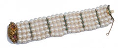 Pulsera de perlas, esmeraldas, rubíes, zafiros, diamantes, oro rosa y plata.