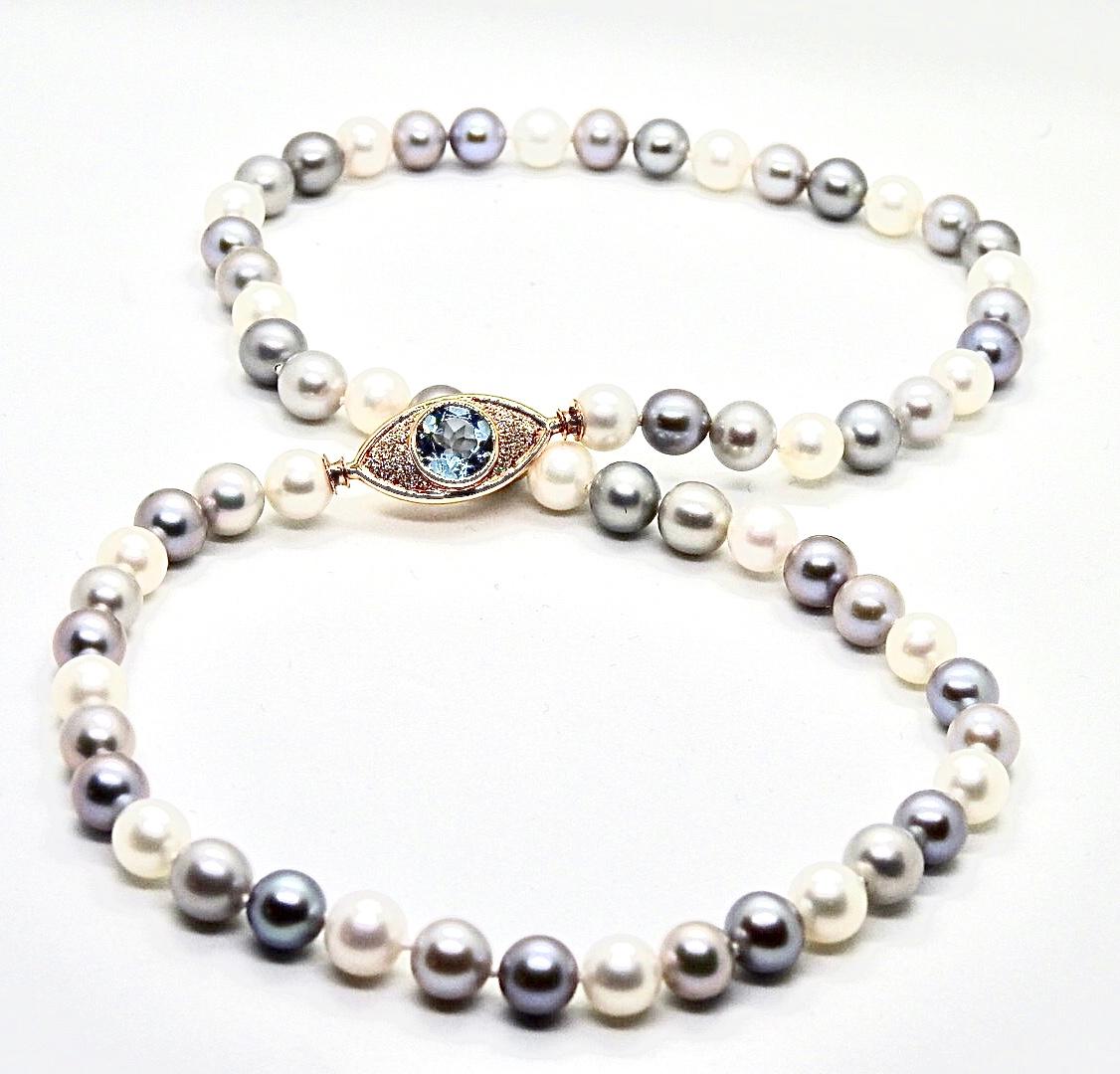 ARGOS necklace is a strand of  8mm cultured pearls, with 18K rose gold 