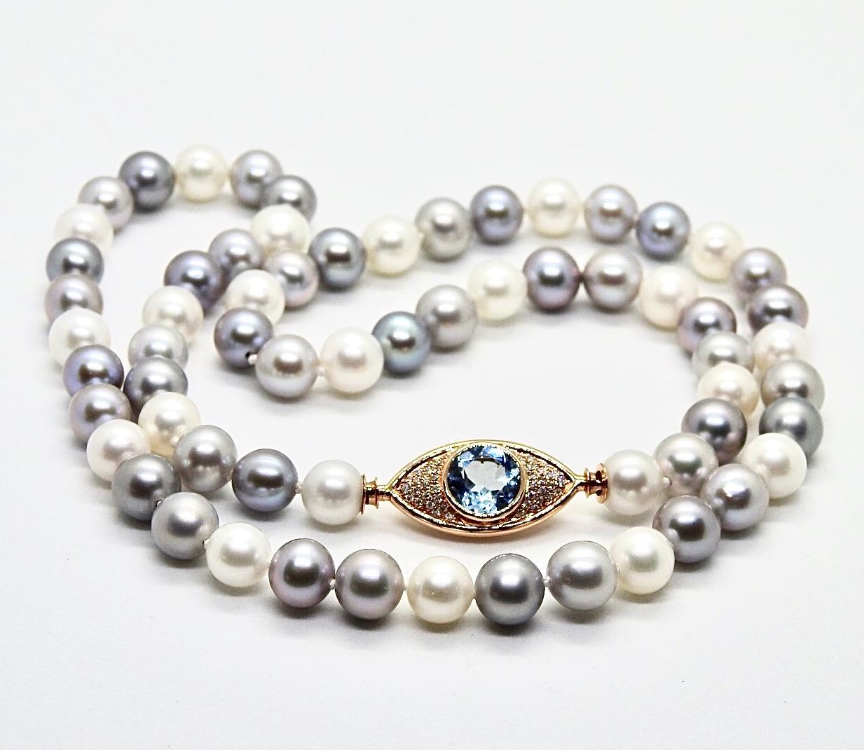 Round Cut Pearls Necklace with 18 Karat Gold, Diamonds and Sky Blue Topaz Eye Clasp For Sale