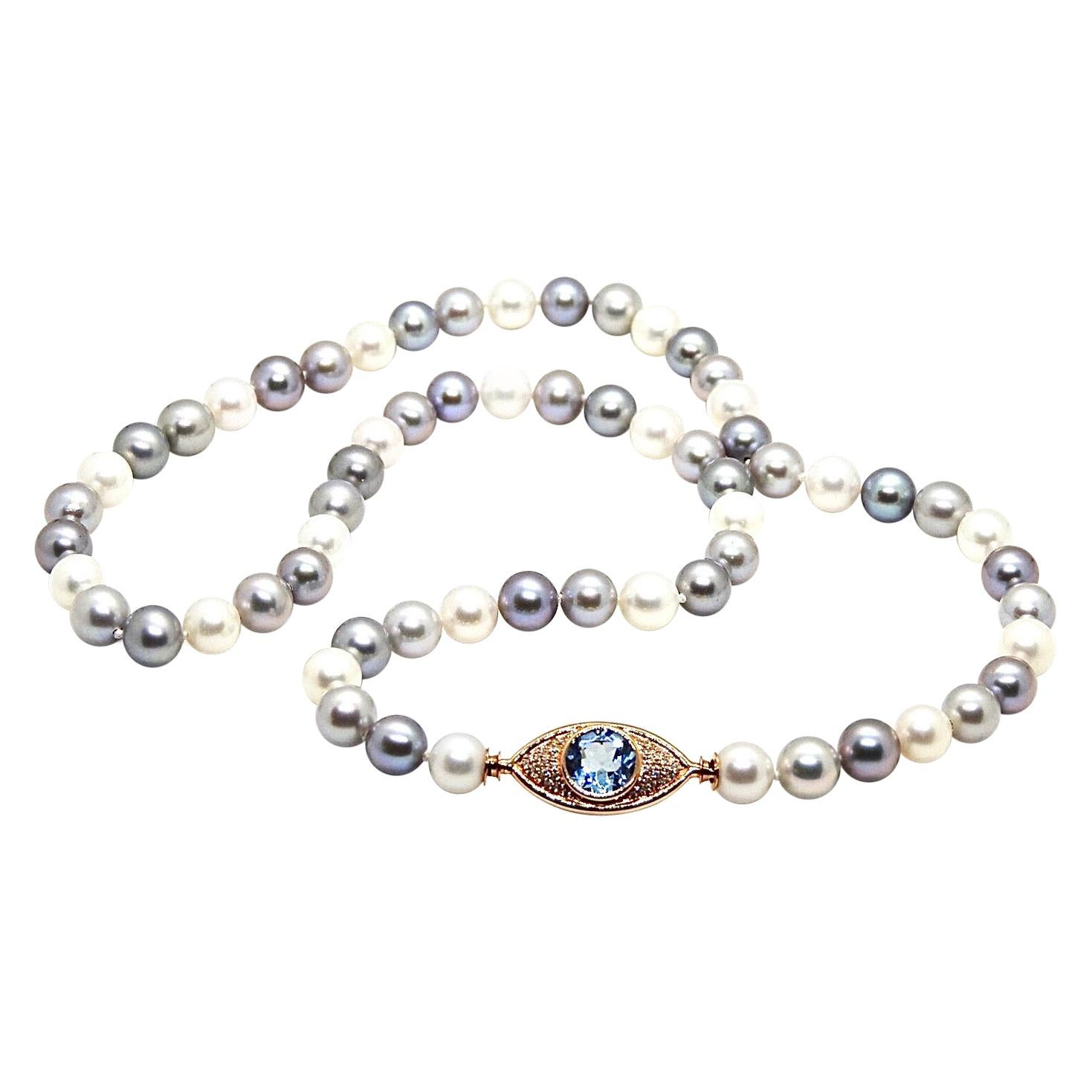 Pearls Necklace with 18 Karat Gold, Diamonds and Sky Blue Topaz Eye Clasp For Sale