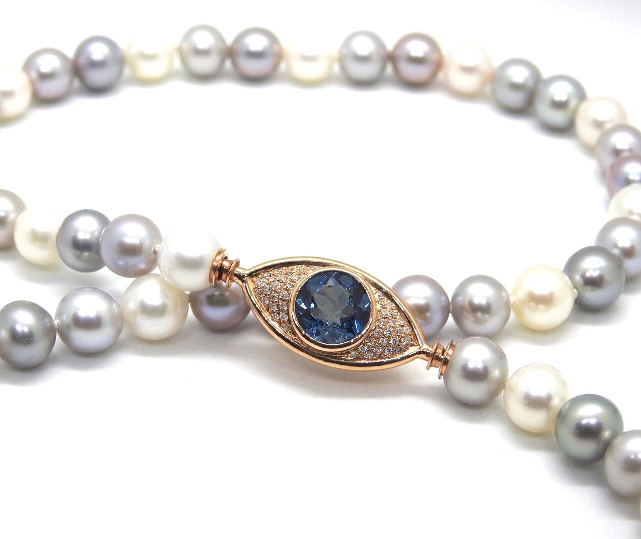 ARGOS necklace is a strand of  8mm cultured pearls, with 18K rose gold 