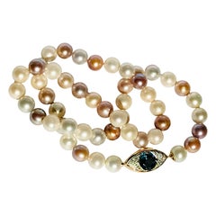 Pearls Necklace with 18 Karat Gold, Diamonds and Topaz Eye Clasp