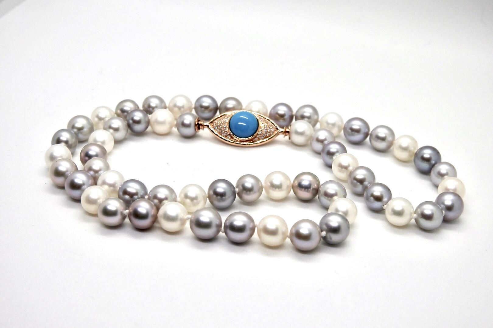 ARGOS necklace is a strand of  8mm cultured pearls, with 18K rose gold 
