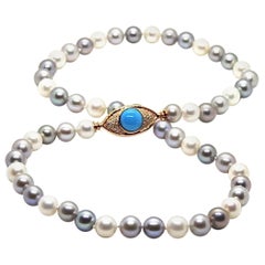 Pearls Necklace with 18 Karat Gold, Diamonds and Turquoise Eye Clasp