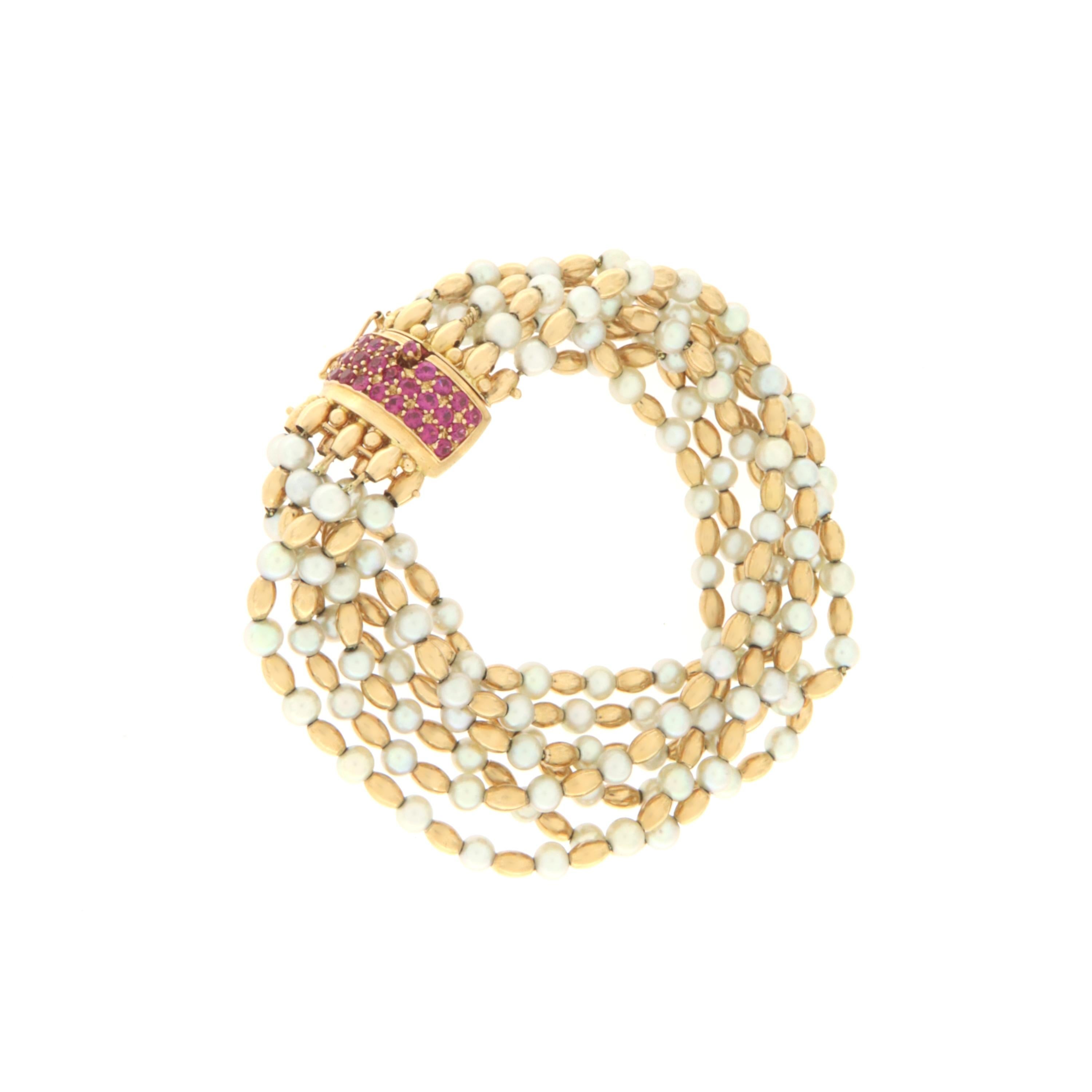 Beautiful 50s 18 karat yellow gold cuff bracelet mounted with cultured pearls and rubies
 
Bracelet total weight 49.50 grams
Rubies weight 1.30 karat
Bracelet length 17.50 cm