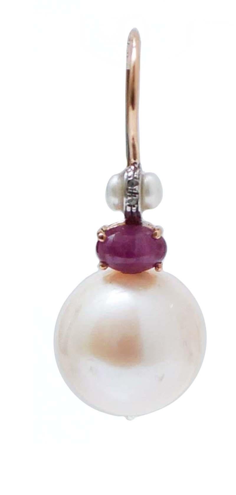 Amazing earrings in 9 kt rose gold and silver structure mounted  with diamonds and a small pearl in the upper part; below, a ruby and a pearl as pendant.
Diamonds 0.16 ct
Rubies 1.77 ct
Pearls 7.30 gr
Total Weight 9.30 gr
RF  *CUH

For any