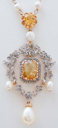 Collier à pendentifs en perles, topaze, diamants, or rose et argent.