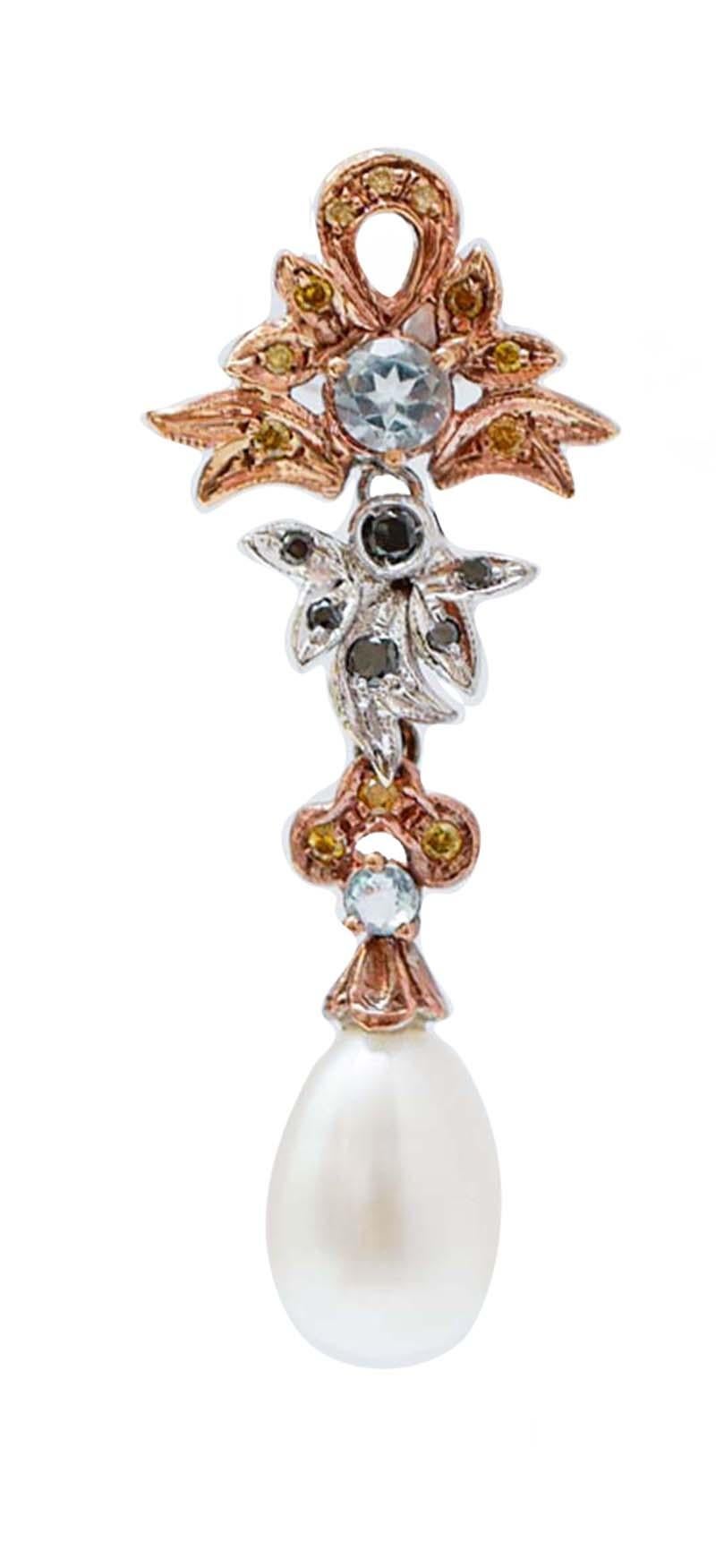 Fantastic earrings in 14 kt rose gold and white gold structure mounted with black and fancy diamonds. Between of them, topazs. As pendant, a pearl.
These earrings were totally handmade by Italian master goldsmiths and they are in perfect