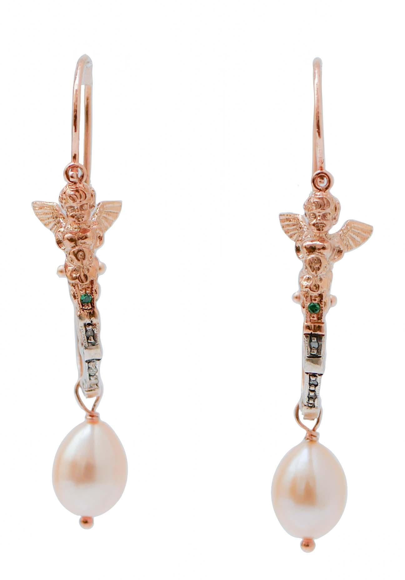Fashion earrings mounted with a little angel in the upper part and, below of it, a tsavorite and diamonds. As pendant, a pearl.
These earrings were totally handmade by Italian master goldsmiths and they are in perfect conditions.
Diamonds 0.04