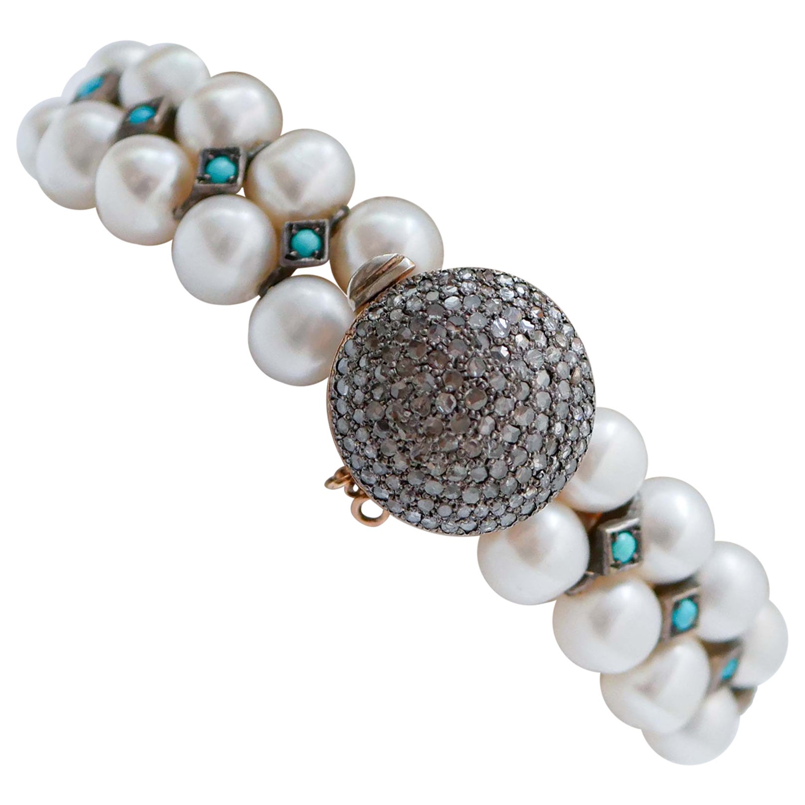 Pulsera de perlas, turquesas, diamantes, oro rosa y plata.