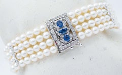 Perles, diamants blancs, saphirs bleus, bracelet Retr en or blanc 14 carats.