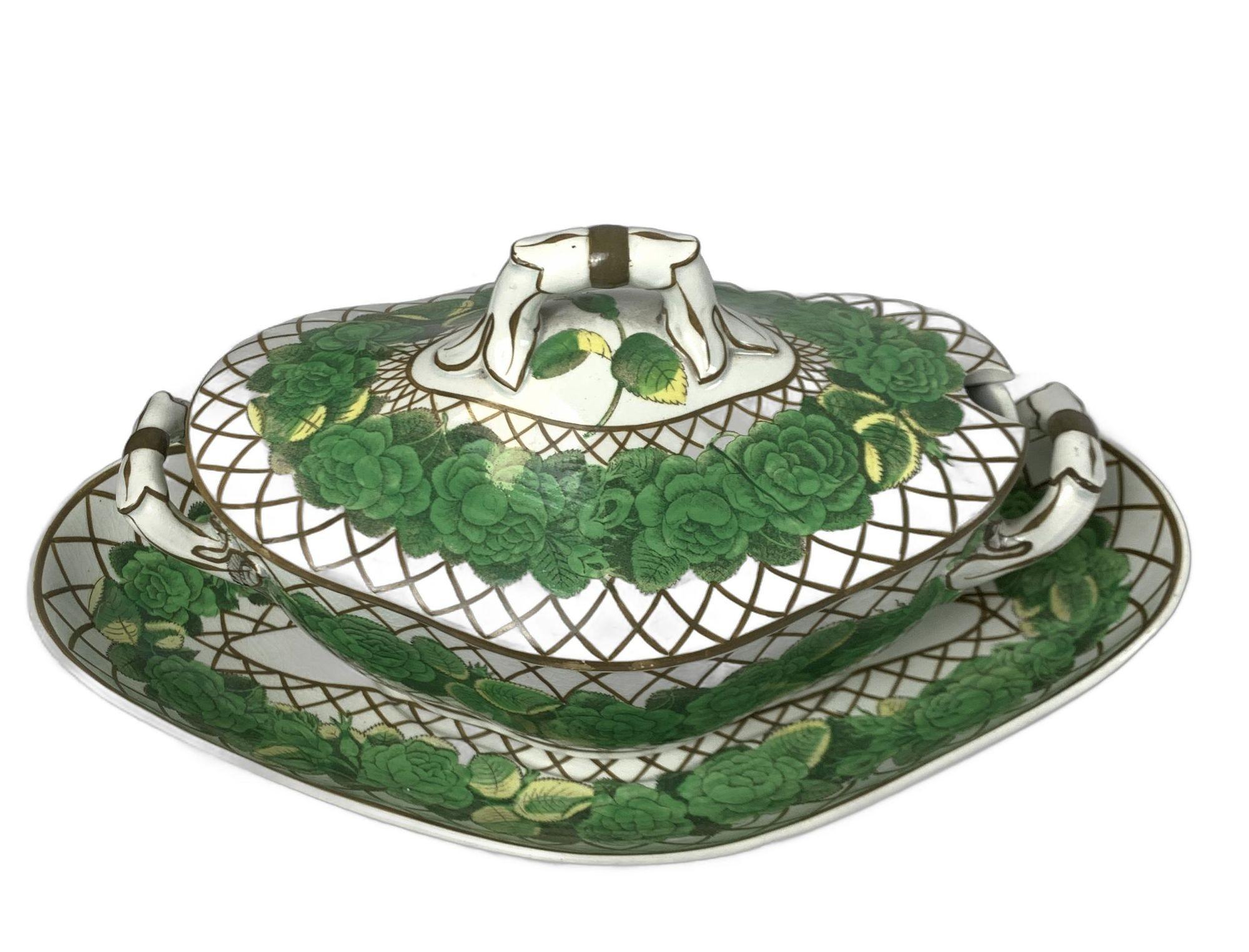 Made in England circa 1810
This set of Spode pearlware dishes features a band of green roses highlighted with yellow and bordered by a brown lattice pattern.
The center of each dish of the four oval-shaped dishes and the underplate of the tureen