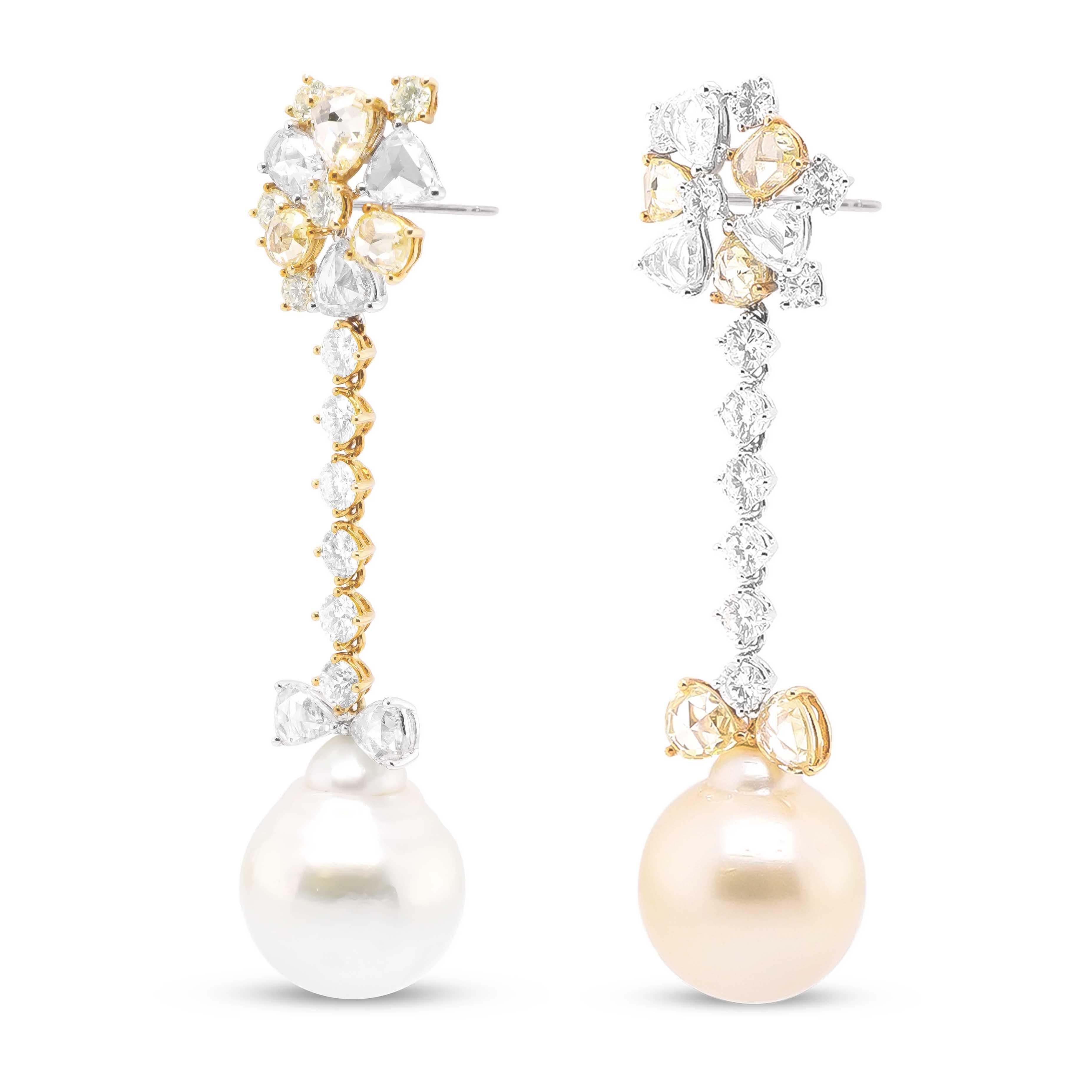 A pair of chandeliers dissimilar in color - one with a 25.55 carat white pearl suspended at the bottom, while the other has a 25.55 carat golden yellow pear suspended at the bottom.
Pearls are beauties formed in the bodies of Mollusk's in the ocean.