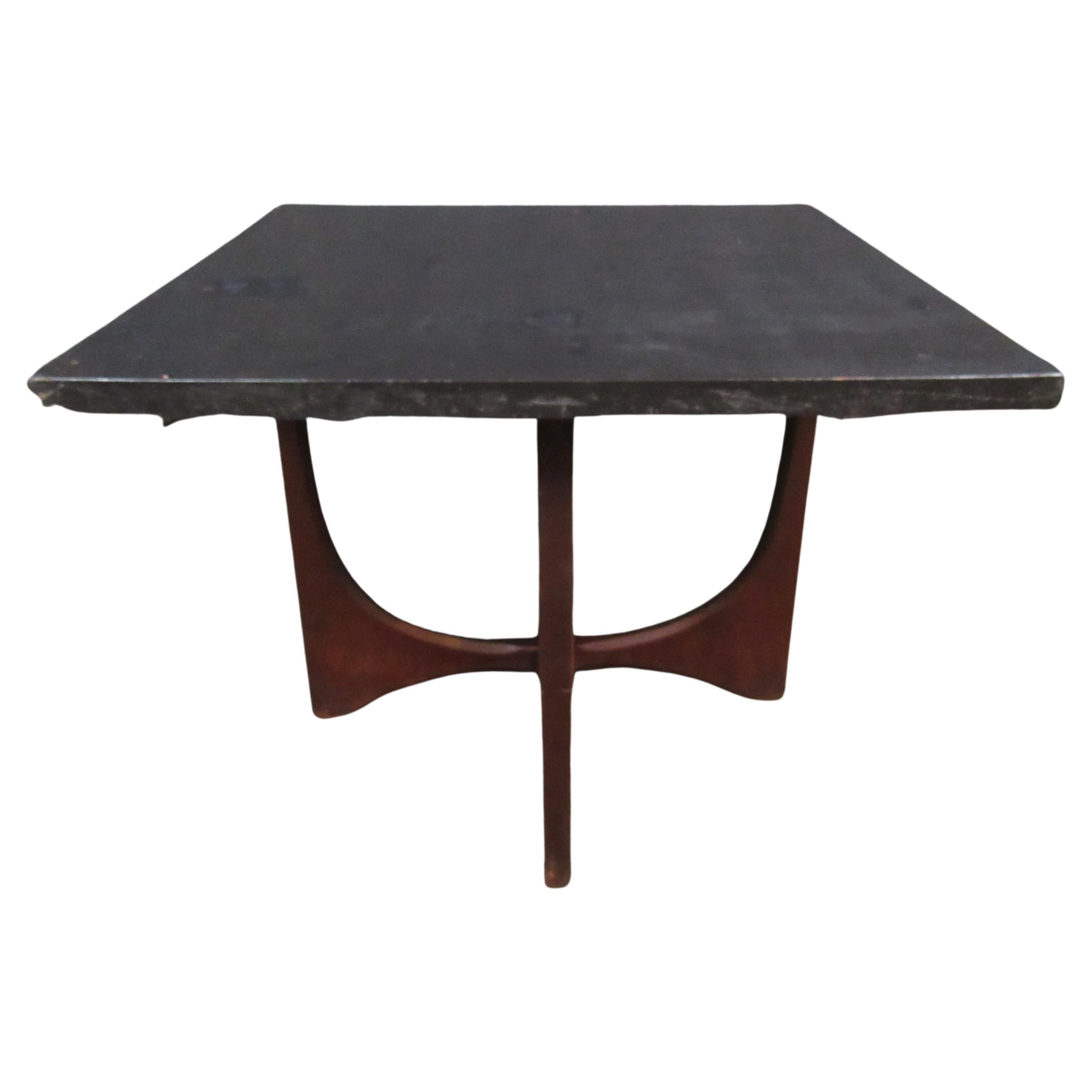 Gorgeous black top side table in the classic style of legendary designer Adrian Pearsall! Sculptural carving on the legs adds uniqueness without sacrificing stability. 
Please confirm item pickup location (New York or New Jersey) with seller.