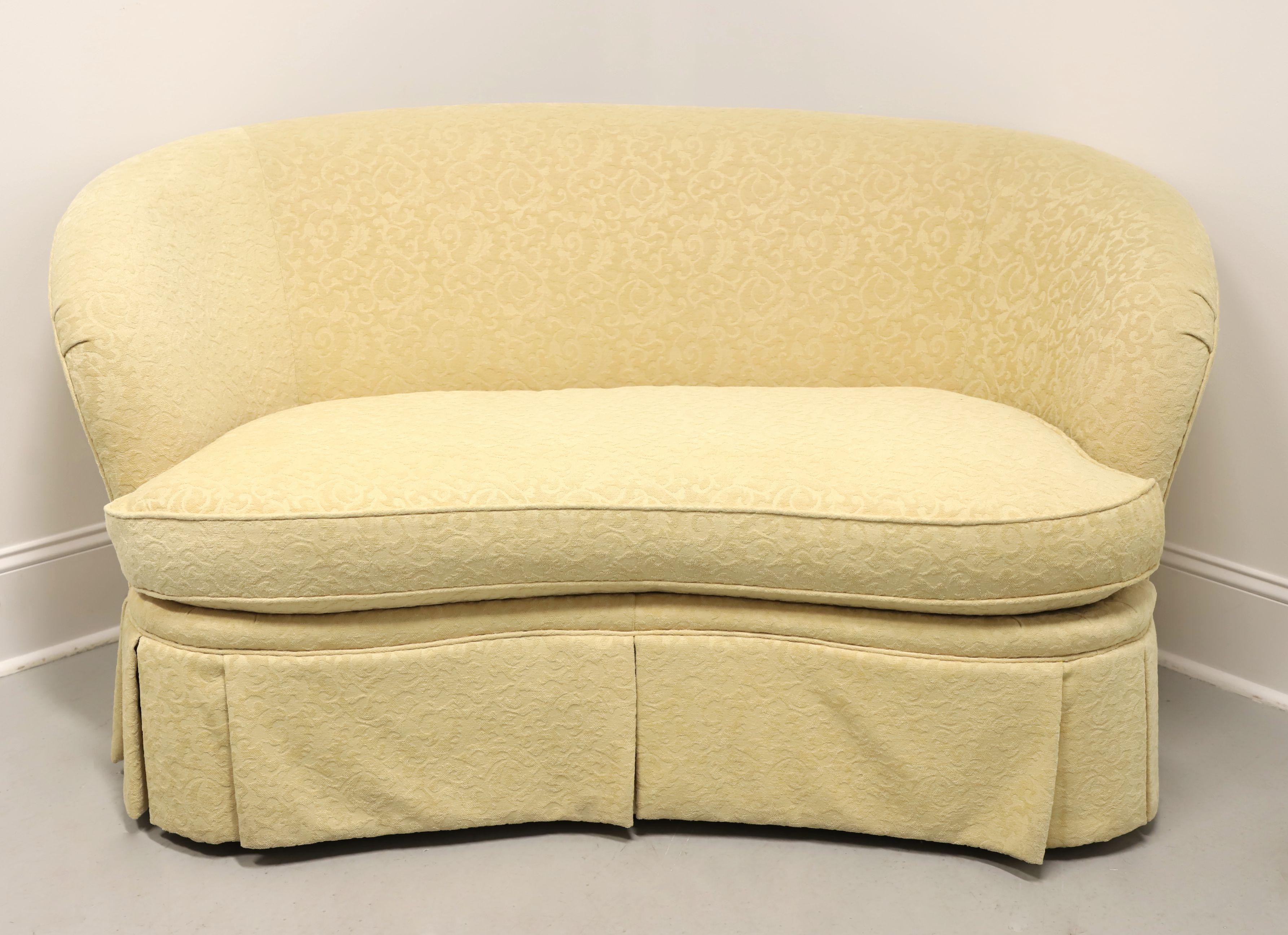 A modern Contemporary style loveseat by Pearson Furniture. Hardwood framed, high quality constructed, crescent shaped with a low profile, luxuriously sofa neutral beige colored brocade fabric upholstered, reversible seat cushion, and a full pleated